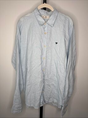 Men's Light Blue Casual Button-Down Shirt with Subtle Chest Emblem